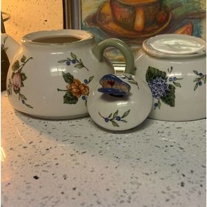 Vintage garden porcelain tea pot in teacup porcelain tea pot and tea cup